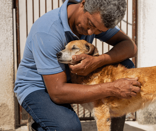 A person sharing a close bond with their dog